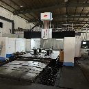[]纽威4米龙门，工作台2.5米4米，门宽3.3米，门高1.7米.